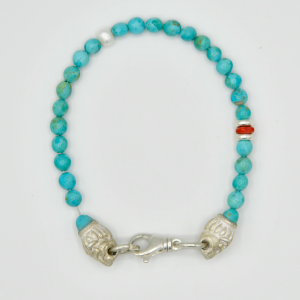 Kingman Turquoise with Sterling Silver Lion Heads