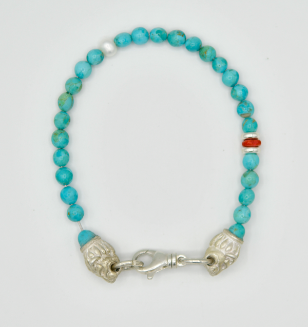 Kingman Turquoise with Sterling Silver Lion Heads