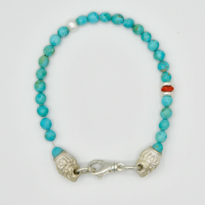 Kingman Turquoise with Sterling Silver Lion Heads